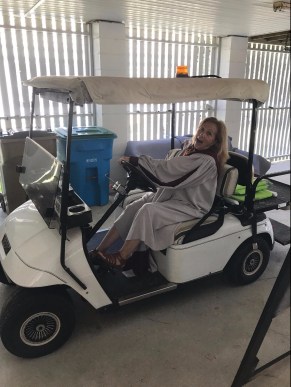 Cathy on golf cart